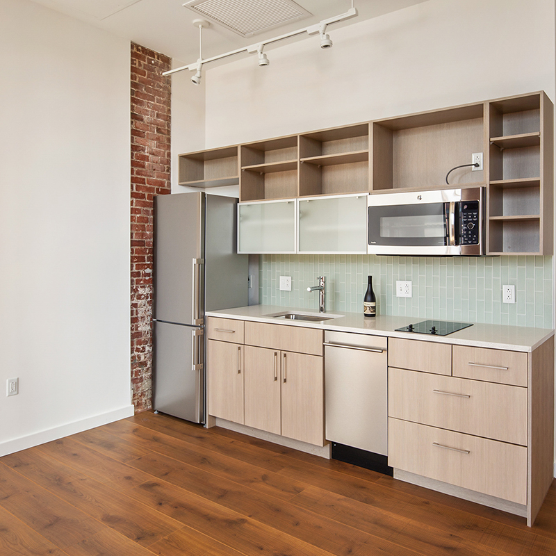 Modern-chic apartment kitchen with modern cabinetry and fixtures