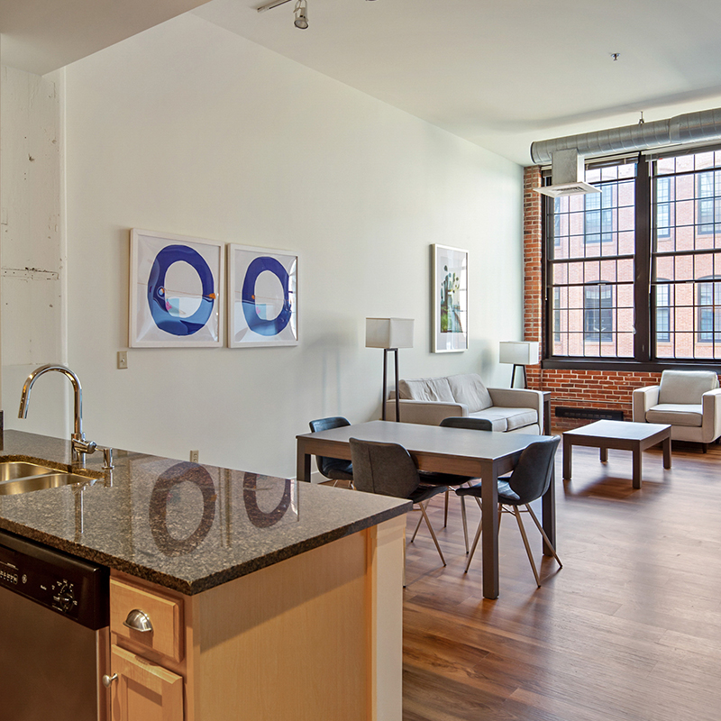 A chic modern apartment with vaulted ceilings and big windows